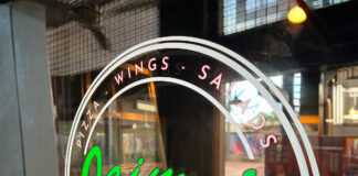 Front window of Jaime's Pizza Kitchen with the restaurant logo visible