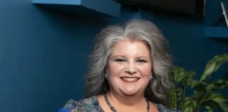 Lisa Nutt, a key leader at the Tucson Association of Realtors, smiling in a professional blue blouse. She is actively working to educate the public on preventing deed fraud and protecting homeowners in Tucson.